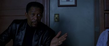 Movie still from “Kiss the Girls” (1997), directed by Gary Fleder – An older black man wearing a leather jacket; Close Up shot, Over the shoulder angle