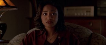 Movie still from “Kiss the Girls” (1997), directed by Gary Fleder – A young woman is looking at the camera; Close Up shot, High angle