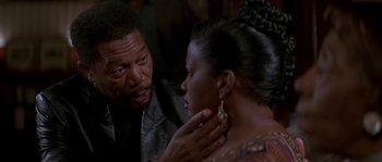 Movie still from “Kiss the Girls” (1997), directed by Gary Fleder – An older man and a younger woman are talking to each other; Close Up shot, Over the shoulder angle