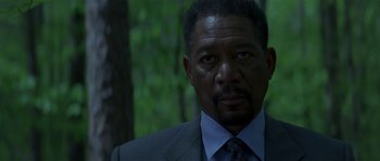 Movie still from “Kiss the Girls” (1997), directed by Gary Fleder – A person wearing a suit and tie; Close Up shot, Over the shoulder angle