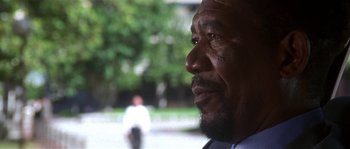 Movie still from “Kiss the Girls” (1997), directed by Gary Fleder – A man with a beard looking to his left; Close Up shot, Low angle