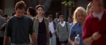 Movie still from “Kiss the Girls” (1997), directed by Gary Fleder – A group of people walking down a street; Medium shot, Over the shoulder angle