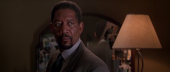 Movie still from “Kiss the Girls” (1997), directed by Gary Fleder – A person wearing a suit and a tie; Close Up shot, Over the shoulder angle