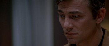 Movie still from “Kiss the Girls” (1997), directed by Gary Fleder – A man's face as he stares off into the distance; Close Up shot, Over the shoulder angle