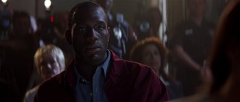 Movie still from “Kiss the Girls” (1997), directed by Gary Fleder – A person wearing a red jacket; Close Up shot, Over the shoulder angle