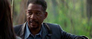Movie still from “Kiss the Girls” (1997), directed by Gary Fleder – An older black man wearing a leather jacket; Close Up shot, Over the shoulder angle