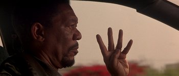 Movie still from “Kiss the Girls” (1997), directed by Gary Fleder – An older man is looking at the sky with his hand up to his face; Close Up shot, Over the shoulder angle