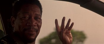 Movie still from “Kiss the Girls” (1997), directed by Gary Fleder – A person holding up four fingers; Close Up shot, Over the shoulder angle