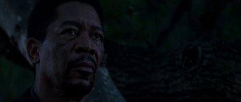 Movie still from “Kiss the Girls” (1997), directed by Gary Fleder – A man's face in the dark; Close Up shot, Low angle