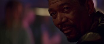 Movie still from “Kiss the Girls” (1997), directed by Gary Fleder – A man's face in a dark room; Close Up shot, Low angle