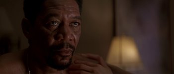 Movie still from “Kiss the Girls” (1997), directed by Gary Fleder – A man's face in a mirror; Close Up shot, Low angle