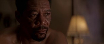 Movie still from “Kiss the Girls” (1997), directed by Gary Fleder – A man's face with tears in his eyes; Close Up shot, Low angle