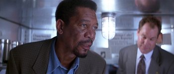 Movie still from “Kiss the Girls” (1997), directed by Gary Fleder – An older man in a suit looking to his left; Close Up shot, Low angle