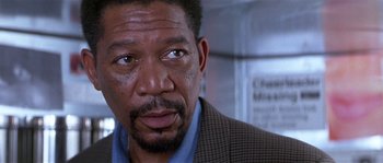 Movie still from “Kiss the Girls” (1997), directed by Gary Fleder – An older man with a serious look on his face; Close Up shot, Low angle