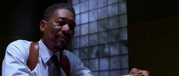 Movie still from “Kiss the Girls” (1997), directed by Gary Fleder – A person wearing a suit and tie; Close Up shot, Low angle