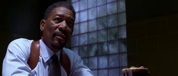 Movie still from “Kiss the Girls” (1997), directed by Gary Fleder – A person wearing a suit and tie; Close Up shot, Low angle