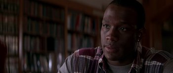 Movie still from “Kiss the Girls” (1997), directed by Gary Fleder – A person wearing a plaid shirt; Close Up shot, Low angle