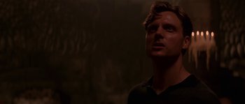 Movie still from “Kiss the Girls” (1997), directed by Gary Fleder – A man standing in a dark room looking up; Close Up shot, Low angle