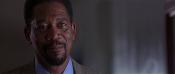 Movie still from “Kiss the Girls” (1997), directed by Gary Fleder – A person wearing a suit and tie; Close Up shot, Low angle