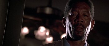 Movie still from “Kiss the Girls” (1997), directed by Gary Fleder – A man's face in a dark room; Close Up shot, Low angle