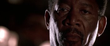 Movie still from “Kiss the Girls” (1997), directed by Gary Fleder – A man's eyes and face; Extreme Close Up shot, Low angle