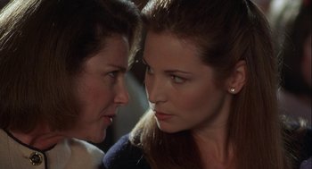 Movie still from “Kissing Jessica Stein” (2001), directed by Charles Herman-Wurmfeld – Two women looking at one another in a dark room; Close Up shot, Over the shoulder angle