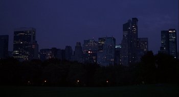 Movie still from “Kissing Jessica Stein” (2001), directed by Charles Herman-Wurmfeld – A view of a city skyline at night with lights on; Extreme Wide shot, High angle