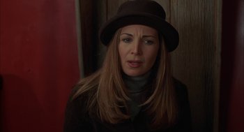 Movie still from “Kissing Jessica Stein” (2001), directed by Charles Herman-Wurmfeld – A person wearing a hat; Close Up shot, Over the shoulder angle