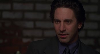 Movie still from “Kissing Jessica Stein” (2001), directed by Charles Herman-Wurmfeld – A person wearing a suit and tie; Close Up shot, Over the shoulder angle