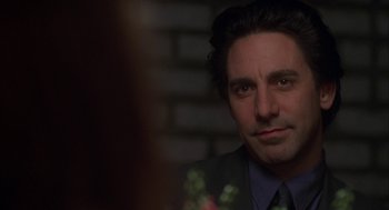 Movie still from “Kissing Jessica Stein” (2001), directed by Charles Herman-Wurmfeld – A person wearing a suit and tie; Close Up shot, Over the shoulder angle
