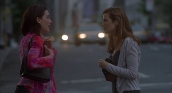 Movie still from “Kissing Jessica Stein” (2001), directed by Charles Herman-Wurmfeld – Two women talking on the side of the street; Medium shot, Over the shoulder angle