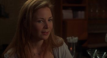Movie still from “Kissing Jessica Stein” (2001), directed by Charles Herman-Wurmfeld – A beautiful woman sitting in front of a table; Close Up shot, Over the shoulder angle