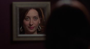 Movie still from “Kissing Jessica Stein” (2001), directed by Charles Herman-Wurmfeld – A person in a mirror; Close Up shot, Over the shoulder angle