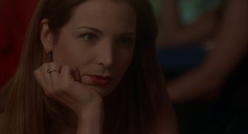 Movie still from “Kissing Jessica Stein” (2001), directed by Charles Herman-Wurmfeld – A beautiful woman with long dark brown hair; Close Up shot, Over the shoulder angle