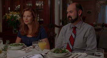 Movie still from “Kissing Jessica Stein” (2001), directed by Charles Herman-Wurmfeld – A man and a woman sitting at a table with a bowl of salad; Medium shot, Over the shoulder angle