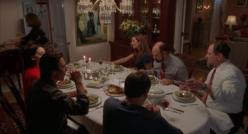 Movie still from “Kissing Jessica Stein” (2001), directed by Charles Herman-Wurmfeld – A group of people sitting around a dinner table; Wide shot, High angle