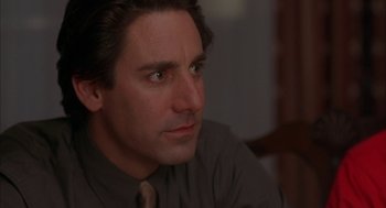 Movie still from “Kissing Jessica Stein” (2001), directed by Charles Herman-Wurmfeld – A person wearing a shirt and tie; Close Up shot, Over the shoulder angle