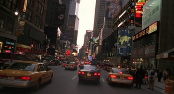 Movie still from “Kissing Jessica Stein” (2001), directed by Charles Herman-Wurmfeld – A city street filled with lots of traffic at night; Extreme Wide shot, High angle