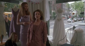 Movie still from “Kissing Jessica Stein” (2001), directed by Charles Herman-Wurmfeld – Two women standing in front of a dress shop window; Medium shot, Over the shoulder angle