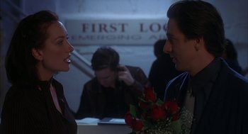 Movie still from “Kissing Jessica Stein” (2001), directed by Charles Herman-Wurmfeld – A man and a woman talking to each other; Medium shot, Over the shoulder angle