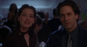 Movie still from “Kissing Jessica Stein” (2001), directed by Charles Herman-Wurmfeld – A man and a woman standing next to each other in a room; Close Up shot, Low angle