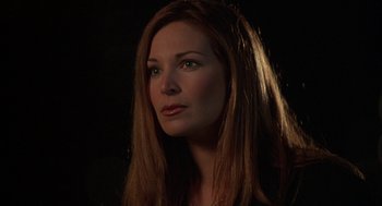 Movie still from “Kissing Jessica Stein” (2001), directed by Charles Herman-Wurmfeld – A woman with long red hair is looking into the distance; Close Up shot, High angle