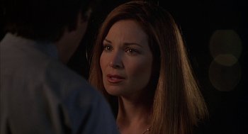 Movie still from “Kissing Jessica Stein” (2001), directed by Charles Herman-Wurmfeld – A person with long brown hair; Close Up shot, Over the shoulder angle