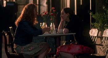 Movie still from “Kissing Jessica Stein” (2001), directed by Charles Herman-Wurmfeld – Two women sitting at a table in front of each other; Medium shot, Over the shoulder angle