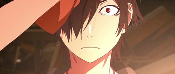 Movie still from “Kizumonogatari Part 3: Reiketsu” (2017), directed by Akiyuki Shinbô – A person's face with a hat on; Extreme Close Up shot, Over the shoulder angle