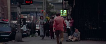Movie still from “Klute” (1971), directed by Alan J. Pakula – A group of people walking down a street; Wide shot, High angle