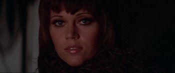 Movie still from “Klute” (1971), directed by Alan J. Pakula – A woman's face in the dark; Close Up shot, Low angle