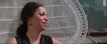 Movie still from “Klute” (1971), directed by Alan J. Pakula – A person sitting in front of a fan; Close Up shot, Low angle