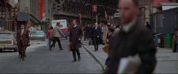 Movie still from “Klute” (1971), directed by Alan J. Pakula – A crowd of people walking down a street; Wide shot, High angle