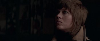Movie still from “Klute” (1971), directed by Alan J. Pakula – A person looking up at the sky; Close Up shot, Low angle